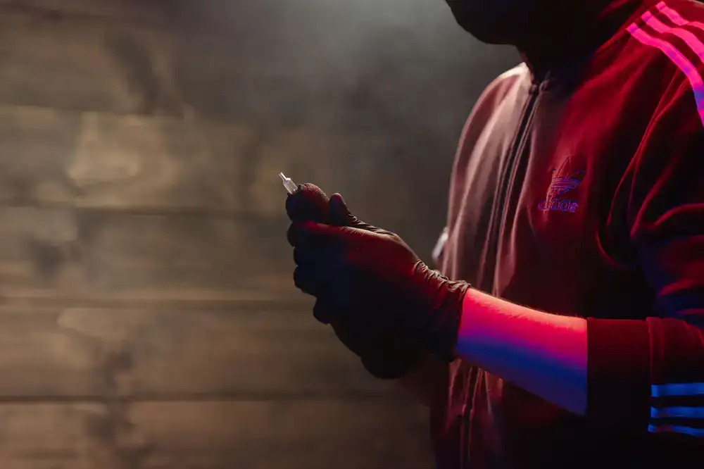 Portrait of a tattoo artist preparing equipment