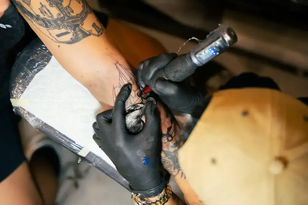 Detailed black and grey sleeve tattoo